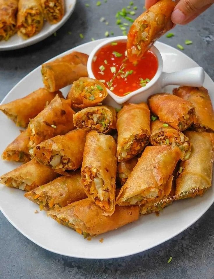Image contains the picture of Exquisite Extravaganza of Gourmet Spring Rolls.
